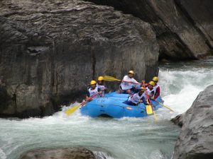 Team Paddle Nepal races during Nepal’s first National Rafting Championship on the Bhote Koshi River in April 2008