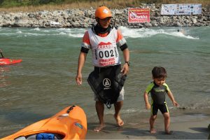 Nim Bahadur Magar with his young son, Kailash at the Himalayan Whitewater Challenge 2011