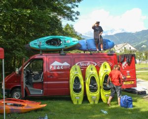 Nim Bahadur Magar standing on top of the Peak UK van loading kayaks during a paddling trip in Austria, 2003.