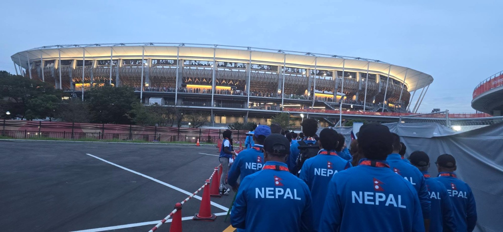 Team Nepal athletes in national team jackets at the 2026 Asian Games in Aichi-Nagoya