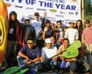 Podium celebration at the first Peak UK Himalayan Whitewater Challenge, 2002, with Nim alongside fellow participants, Pete Astles and Gerry Moffatt.