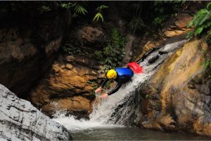 Canyoning with Paddle Nepal.  Abseiling, cliff jumping, natural sliding and swimming while exploring waterfalls in the remote jungle between Pokhara and Chitwan