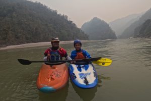 Nim Bahadur Magar kayaking with his son Kailash on the Lower Seti River in Nepal