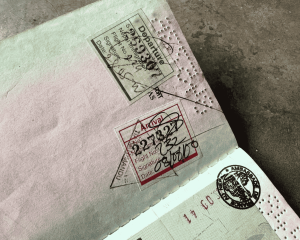 Close-up of passport pages with entry and exit immigration stamps from Nim Bahadur Magar’s first international trip